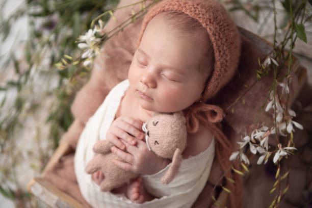 istock Newborn baby girl sleeping in a box. 2001210182