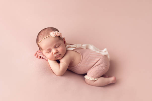 istock Newborn baby girl sleeping 2001210703