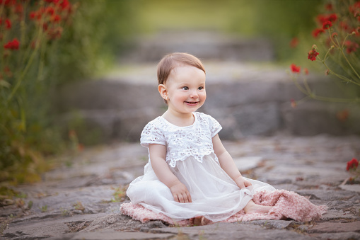 Cute one year old girl enjoying at the garden - Buenos Aires Province - Argentina