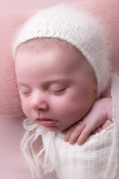 istock Newborn baby girl sleeping 2001253369