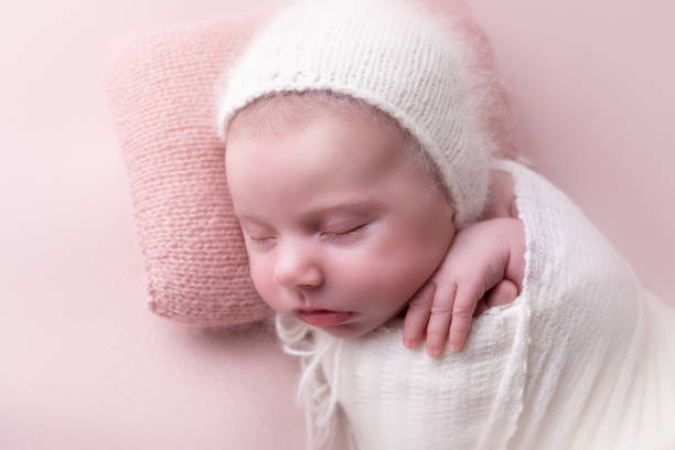 istock Newborn baby girl sleeping 2001253370