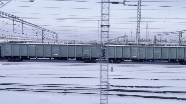 Winter Freight: Snow-Covered Railway with Cargo Train