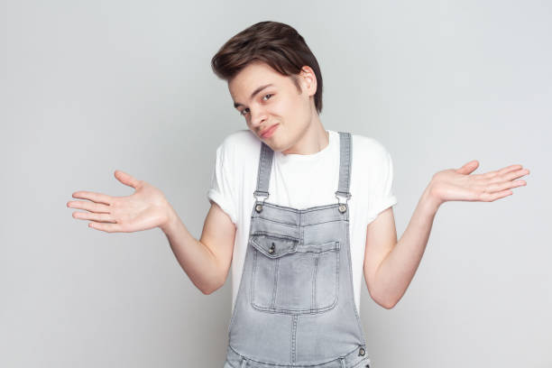 istock Unaware man spreads palms sideways has no idea what to do thinks how to act in troublesome situation 2001284692