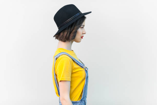 istock Serious hipster woman looking ahead, having strict expression, being in bad mood. 2001285755