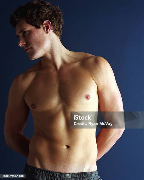 Bare Chested Man With Hands Behind Back Stock Photo - Download Image Now - Brown Hair, Hands Behind Back, Handsome People