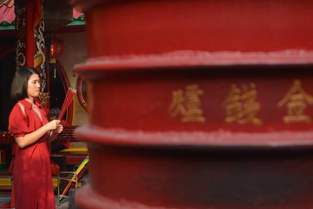 Tangerang, Banten Province (02/10/2024). An Indonesian Chinese Women doing Lunar New Year prayer at Confucius Temple. As Chinese traditional calendar believes, 2024 is the year of Dragon based on Chinese zodiac.