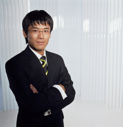 Image of young Asian man on white background