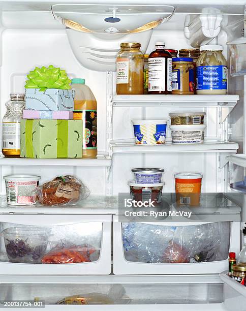 Stack Of Gifts Inside Refrigerator Stock Photo - Download Image Now - Refrigerator, Inside Of, Indoors