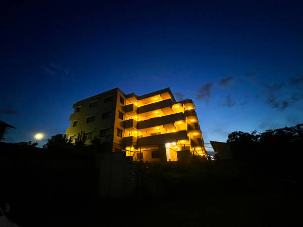 istock Exterior of the illuminated apartment at night 2001407648