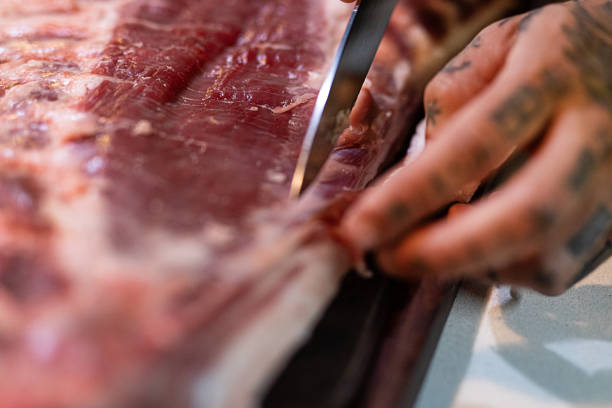 Big piece of Iberian bacon on a wooden board Big piece of Iberian bacon on a wooden board - Buenos Aires - Argentina uncooked bacon stock pictures, royalty-free photos & images