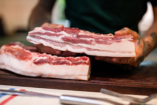 Big piece of Iberian bacon on a wooden board - Buenos Aires - Argentina