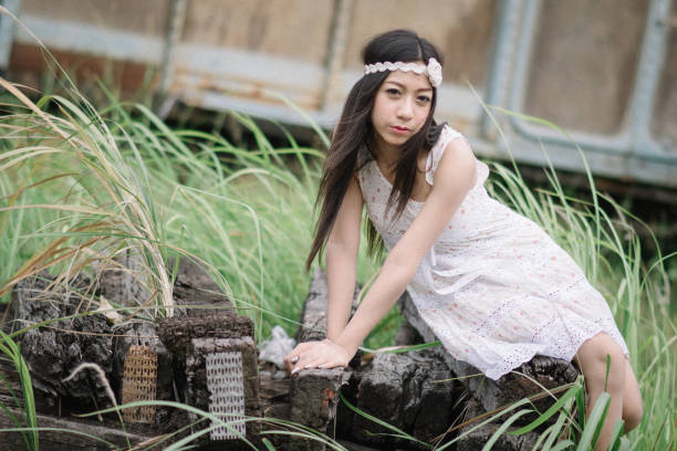 thinking Asian woman