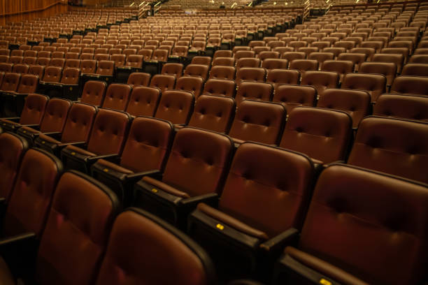 istock Empty theater or cinema auditorium with padded chairs 2001455272