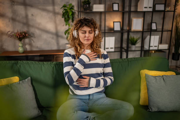 istock A young woman practices guided meditation in the living room 2001498043