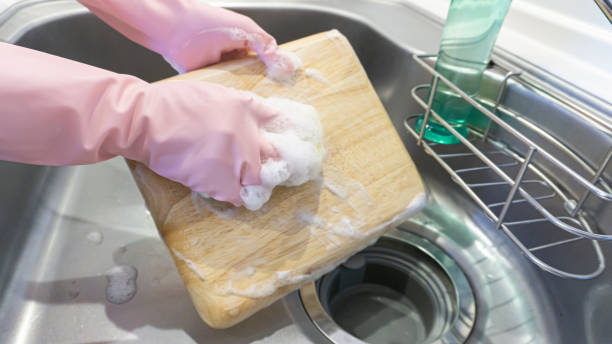 istock person washing dishes in the kitchen 2001501777