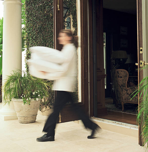 Room service attendant walking with pillows (blurred motion)  caterer photos stock pictures, royalty-free photos & images