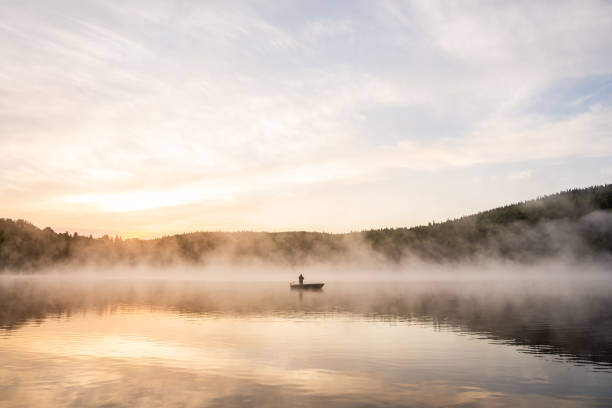 istock A senior man fishing at sunrise. 2001543787