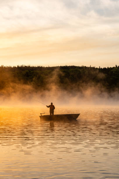 istock A senior man fishing at sunrise. 2001544331