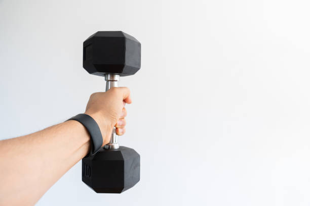 istock POV Fitness: Lifting 10lb Dumbbell with Wrist Band 2001567451