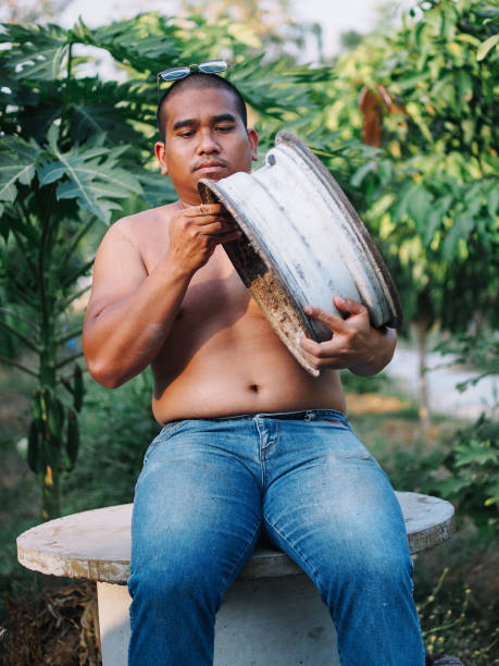 worker carry steel wheel