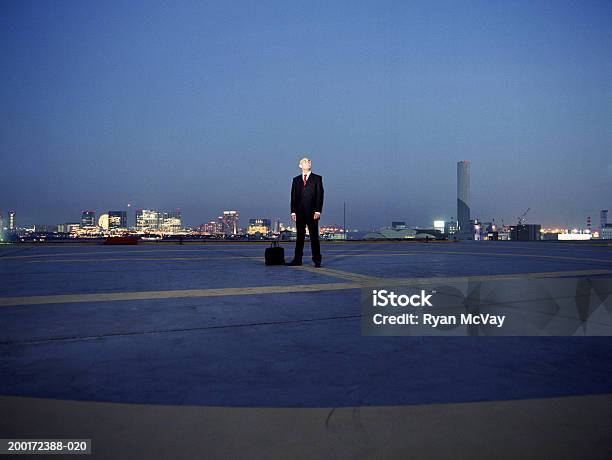 Japan Tokyo Odaiba Young Businessman On Helipad Looking Up Night Stock Photo - Download Image Now