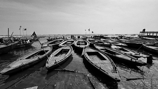 Manual boats in river landscape black and white stock photo