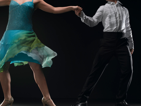 Capturing the enduring love and grace of a senior couple in a ballroom dancing class, where they share moments of joy, connection, and the beauty of dance, proving that age is no barrier to the magic of romance