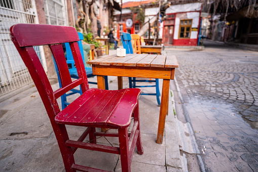red chair and table are on street street cafe in ayvalik turkey horizontal travel still