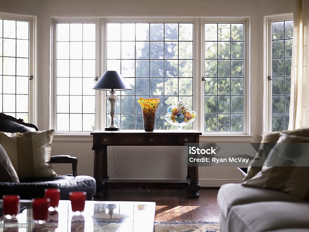 Domestic living room (focus on side table beside window)  Indoors Stock Photo