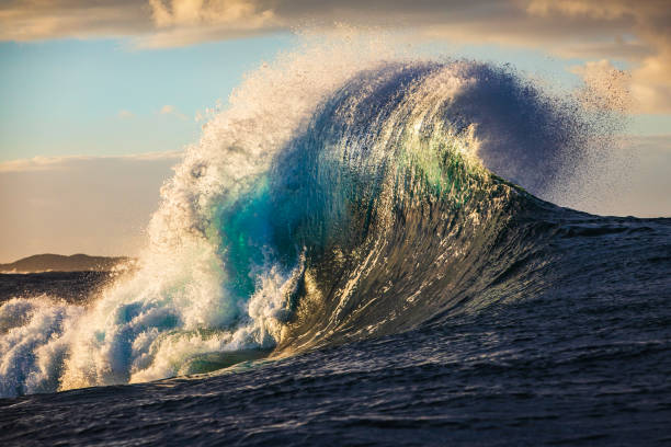 istock Unique wave shape on reef in the ocean with warm morning light 2001972859