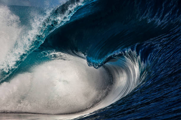istock Powerful wave breaking on reef in the ocean with soft golden light and dramatic sky 2001981872