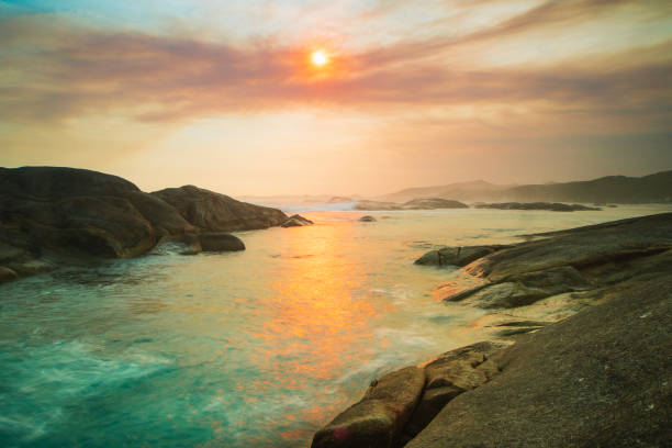istock Seascape with sun setting over the ocean at the beach at Greens Pool 2002023272