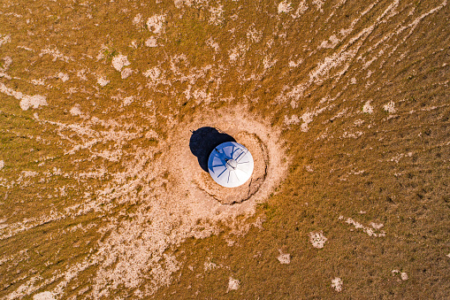 Aerial view of silo on arid land