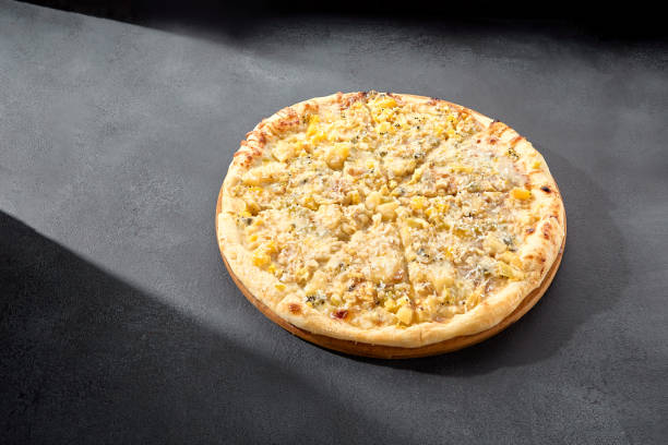 Four cheese pizza with a rich blend of creamy and flavorful cheeses on a golden crust, an Italian classic