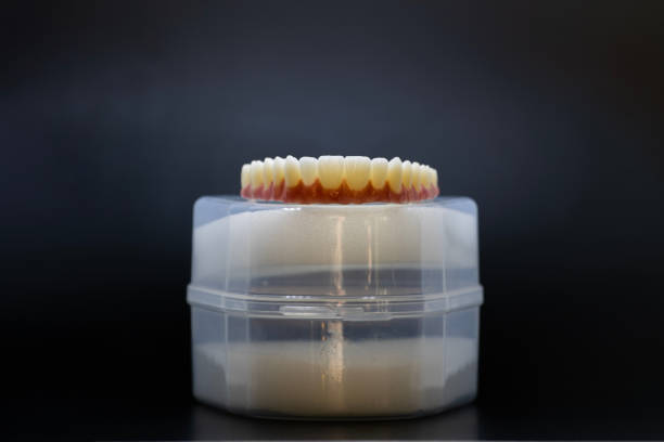 New teeth and plastic box waiting to go to their owner
