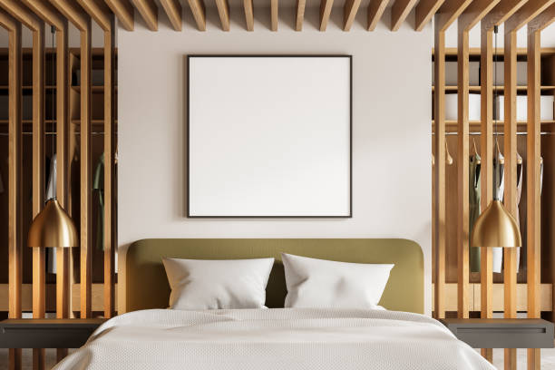 istock Stylish hotel bedroom interior with bed, wardrobe and clothes. Mockup frame 2002082242