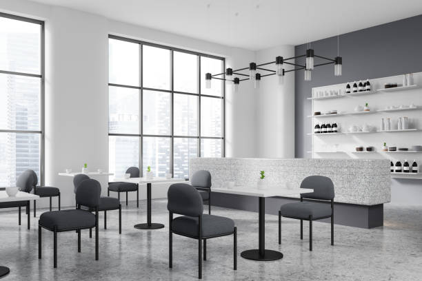 istock Modern cafe interior with bar counter and dining tables with chairs, window 2002089620