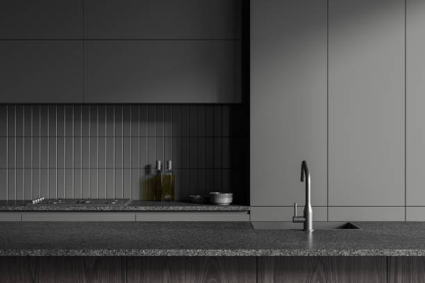 istock Grey home kitchen interior with bar counter, sink and kitchenware with shelves 2002090137