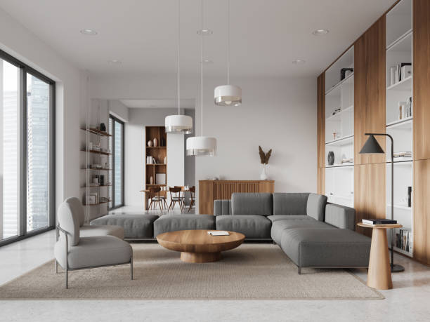 istock Stylish home living room interior with couch and dining table, panoramic window 2002098573