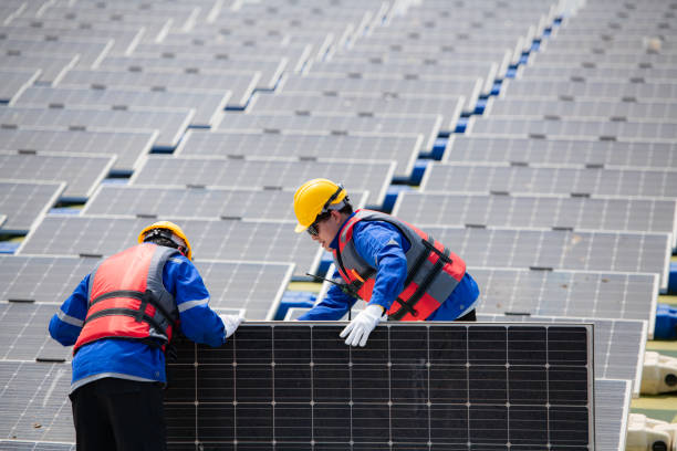 Photovoltaic engineers work on floating photovoltaics. Inspect and repair the solar panel equipment floating on the water.