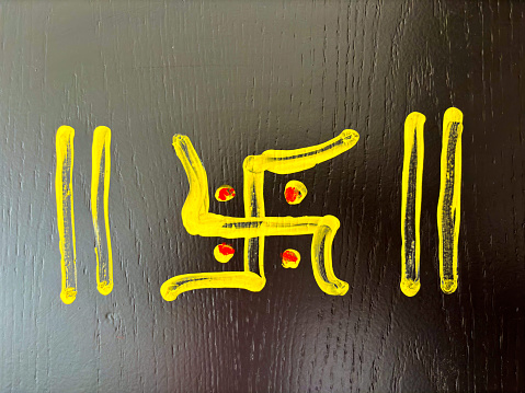 Home entrance door with swastika symbol made in turmeric India