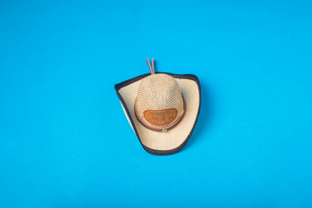 Small hat with the word Mexico isolated on blue background. Mexican souvenir.