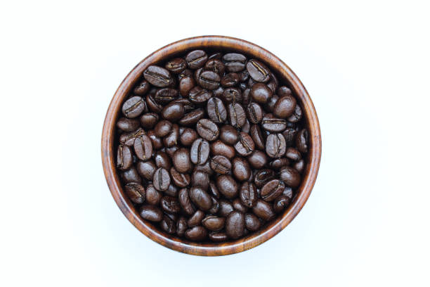 istock Roasted coffee beans in a wooden bowl top view 2002142113