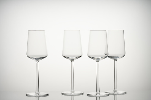 Wine glasses in beautiful light with light gray background