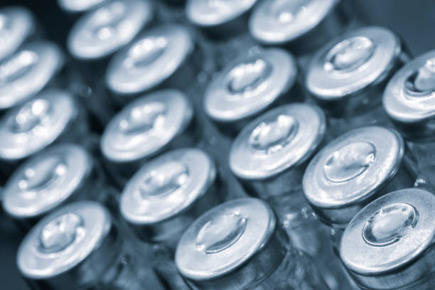 istock Pharmaceutical industry. Production line machine conveyor with glass bottles ampoules at factory. Pharmaceutical industry concept background. 2002148421