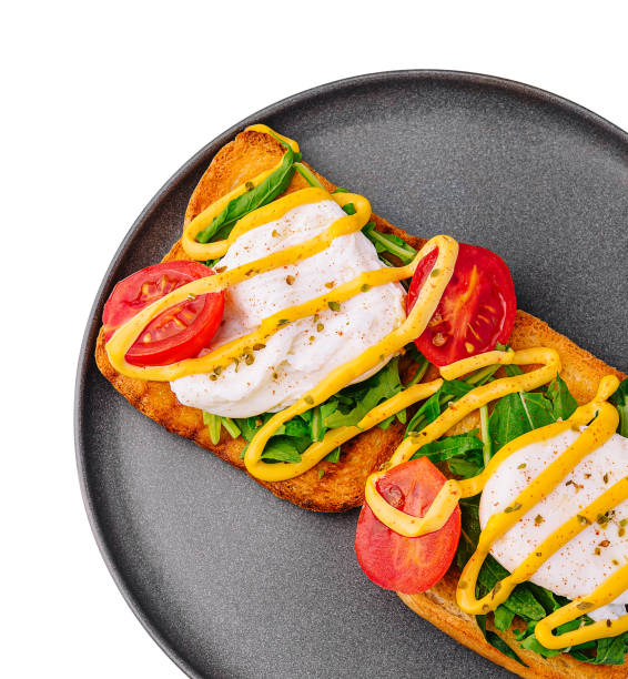 Poached egg with arugula, cherry tomatoes and toast Poached egg with arugula, cherry tomatoes and toast egg cherry tomato rye stock pictures, royalty-free photos & images