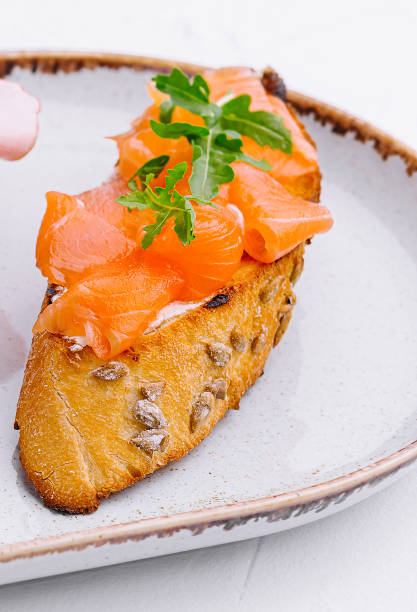 bruschetta with salmon on plate close up