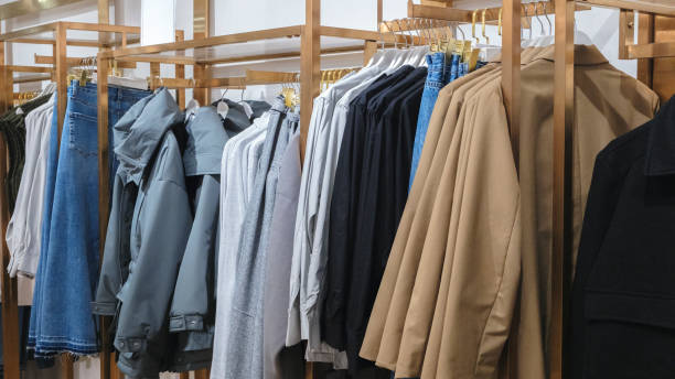 istock Multicolor family clothes on hangers in store 2002155755