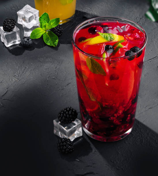 istock red tropical cocktail with ice cubes 2002157333