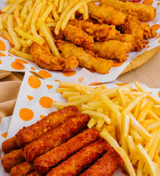 istock french fries with chicken nuggets close up 2002163602